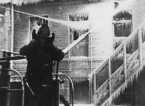 A firefighter using a fire hoseAI-generated content may be incorrect.